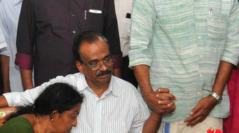 V.P. Sahadevan and Jayashree, parents of S. Achu Dev with  A. Sampath, MP.  (Photo:DC FILE)