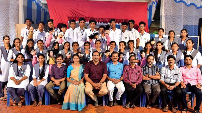 The 30-member Additional Skill Acquisition Programme (ASAP) team of Government Higher Secondary School, Kunhimangalam, poses for a photo with teachers.