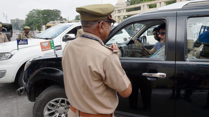 Police personnel keep a watch on the visitors at Uttar Pradsh assembly in Lucknow on Friday after PETN explosives were found. (Photo: PTI)