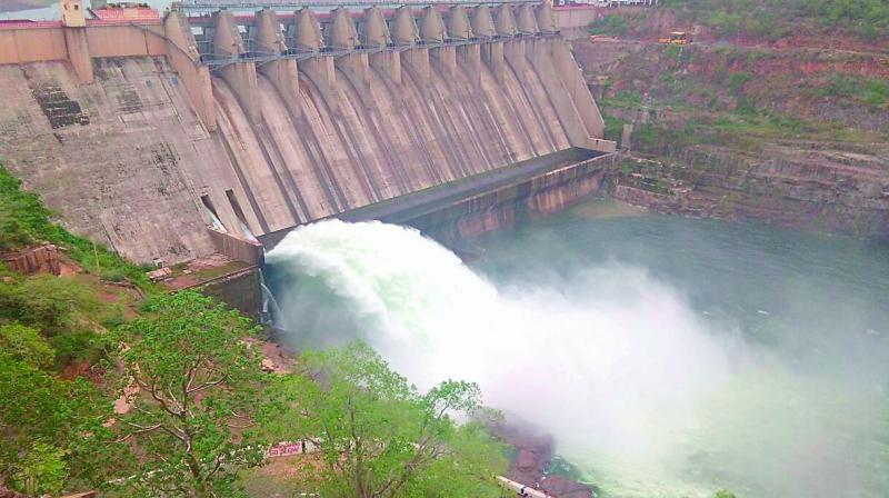 Water flows from Srisailam project after opening of a sluice gate. 2 TMC water released for drinking water purpose on Saturday. (Photo: DC)