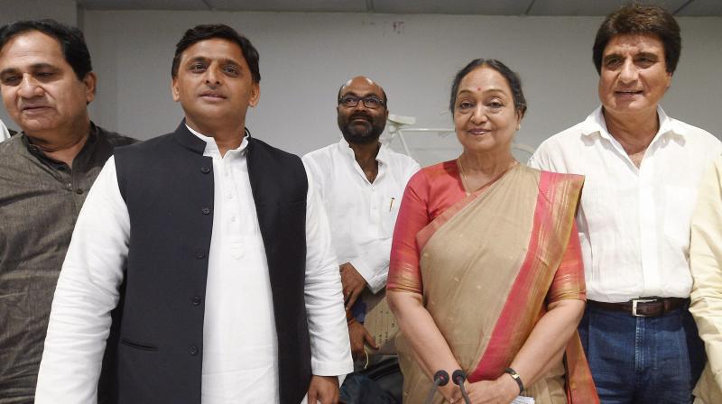 UPAs presidential candidate Meira Kumar meets with Samajwadi Party chief Akhilesh Yadav at the party office in Lucknow on Friday. Congress leader Raj Babbar is also seen. (Photo: PTI)