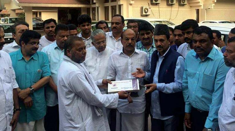 Registration papers being given to Jalaluddin, father of Junaidin at Faridabad, on Wednesday. (Photo: DC)