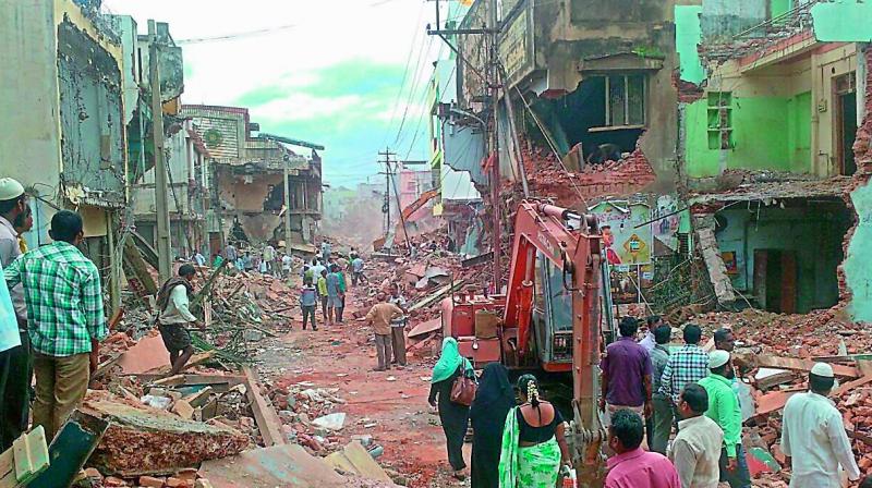 Shops demolished as part of road widening in Nandyal. (Photo: DC)