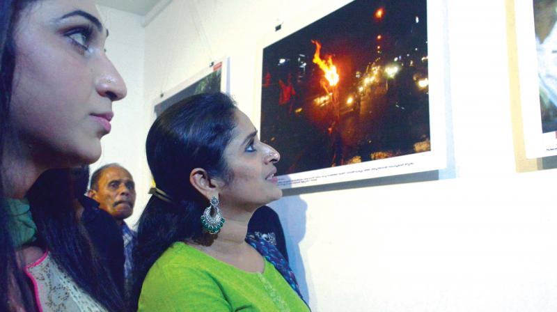 Anjali Ameer and  Surabhi Lakshmi at the photo exhibition. (Photo:  VISWAJITH.K)