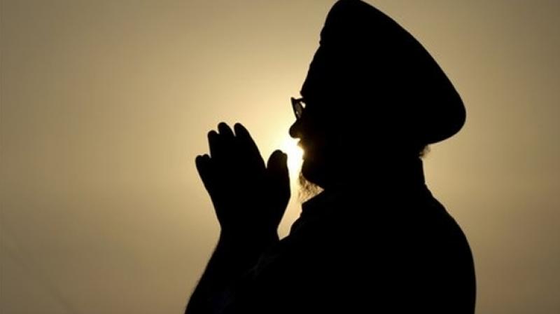 A person from Sikh faith praying (Photo: AP)