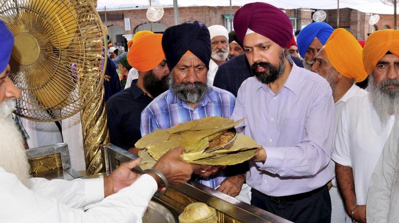 Tanmanjeet Singh Dhesi who became Britains first turban-wearing Sikh Member of Parliament, paying obeisance at Golden temple in Amritsar. (Photo: PTI)
