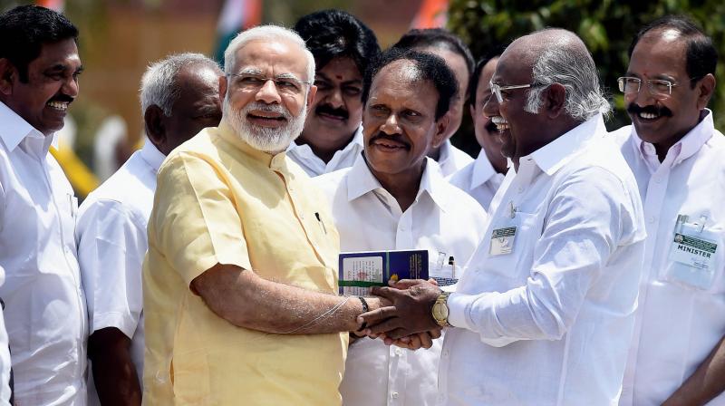 Rameswaram: Prime Minister Narendra Modi being welcomed by Ramanathapuram MP Anwar Raja during the inauguration of late President A PJ Abdul Kalams memorial at Peikarumbu in Rameswaram, Tamil Nadu on Thursday. (Photo: PTI)