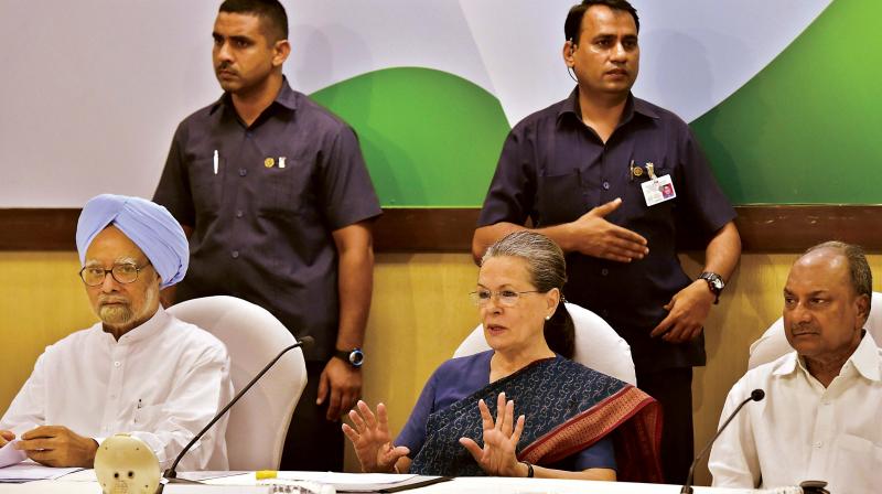 Congress president Sonia Gandhi with former prime minister Manmohan Singh at the Congress Working Committee meeting in New Delhi on Tuesday. (Photo: PTI)