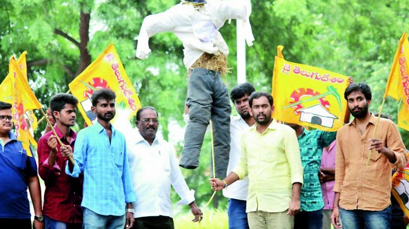 Telugu Yuvatha activists, led by R. Sai Krishna, hanged the effigy of Mr Jagan to a noose fixed to a tree at the Acharya Nagarjuna University.