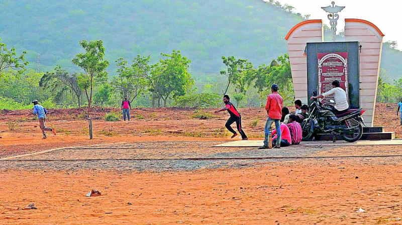 AIIMS plaque area turns as playground to children to play cricket at Mangalagiri. The AIIMS construction remained a non-starter for the past 18 months despite sanction of crores of funds. (Photo: DC)