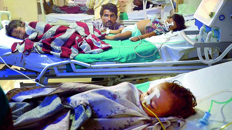 Children admitted in the state-run Baba Raghav Das Medical College in Gorakhpur on Saturday. (Photo: PTI)