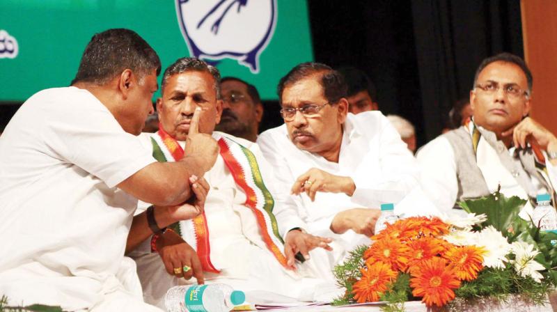 KPCC president Dr G. Parameshwar with working president Dinesh Gundurao and Member of Parliament K.H. Muniyappa during a party event in Bengaluru on Sunday. (Photo: KPN)