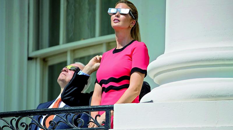 Ivanka Trump watching the eclipse on Monday.