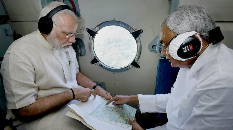 Prime Minister Narendra Modi with Chief Minister of Bihar Nitish Kumar conducting an aerial survey of flood affected areas, in Bihar. (Photo: PTI)