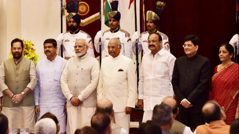 President Ram Nath Kovind, Vice President M. Venkaiah Naidu, Prime Minister Narendra Modi pose with new Cabinet Ministers after the reshuffle at Rashtrapati Bhavan in New Delhi on Sunday. (Photo: PTI)