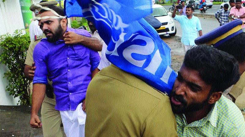 Police removes KSU activists from near the venue where the meeting was scheduled in Kochi on Sunday. (Photo: DC)