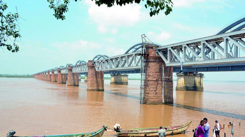 Water level in the River Godavari remains steady at Pushkar ghat in Rajahmundry on Monday. As the water level touches 10.30 ft at Sir Arthur Cotton barrage at Dowleswaram, water resources authorities release 1.59 lakh cusecs of water into the sea. (Photo: DC)