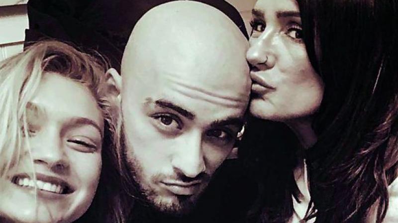 Zayns mother Trisha Malik took to Instagram on Monday to share a photo of herself with Zayn and his famous girlfriend Gigi Hadid.