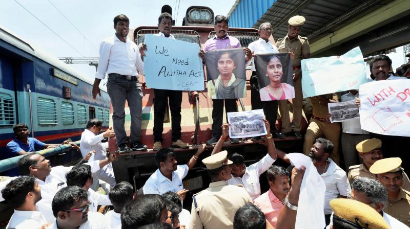 Members of Coimbatore Bar Association raise slogans during a Rail Roko protest against NEET Exams and demanding justice for student Anithas death, in Coimbatore. (Photo: PTI)