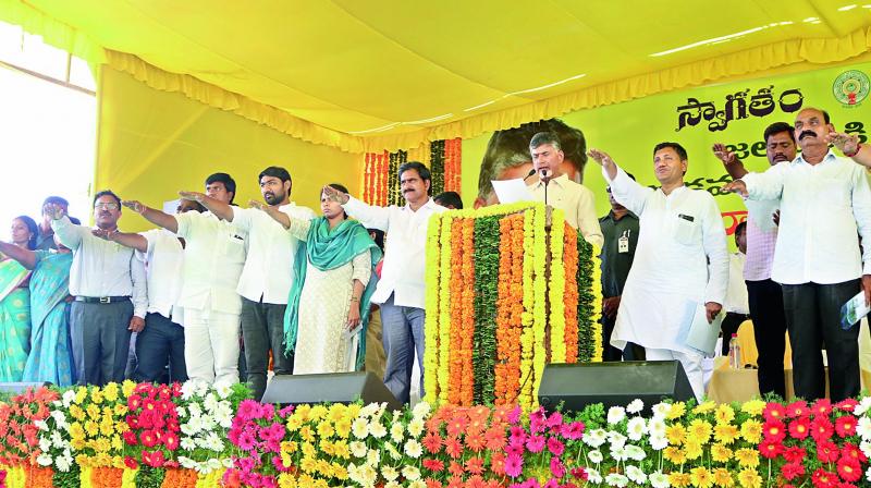AP Chief Minister N. Chandrababu Naidu administers an oath to officials at a function to dedicate the Muchumarri irrigation project to the nation on Friday. (Photo: DC)