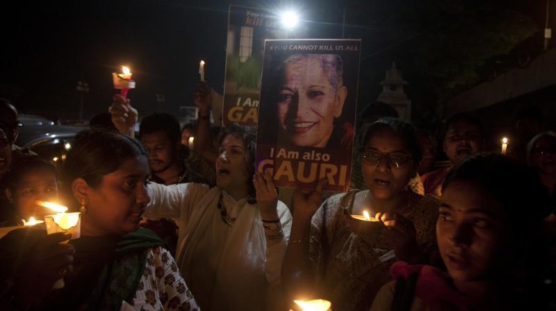 Indian protesters participate in a candle light vigil to protest the killing of Indian journalist Gauri Lankesh in Hyderabad. (Photo: AP)