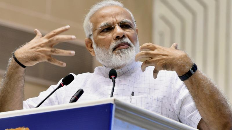 Prime Minister Narendra Modi addresses during a function on the occasion of 125th anniversary of Vivekanandas Chicago Address and birth centenary of Deendayal Upadhyay in New Delhi on Monday. (Photo: PTI)