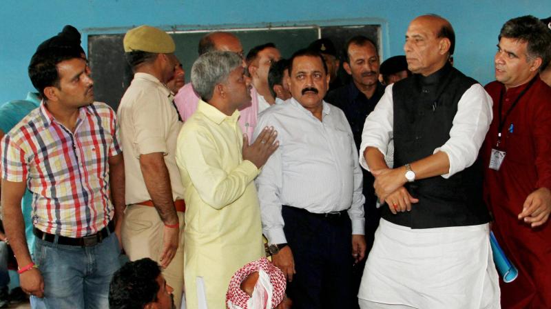 Union Home Minister Rajnath Singh, along with MoS, PMO Jitendra Singh, visiting a border migrants camp in Nowshera sector of Rajouri district on Monday. (Photo: PTI)