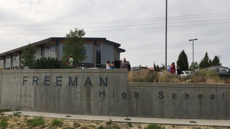 People gather outside of Freeman High School after reports of a shooting at the school in Rockford, Washington. (Photo: AP)
