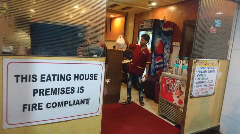 A fire-proof declaration in front of a Mumbai restaurant.