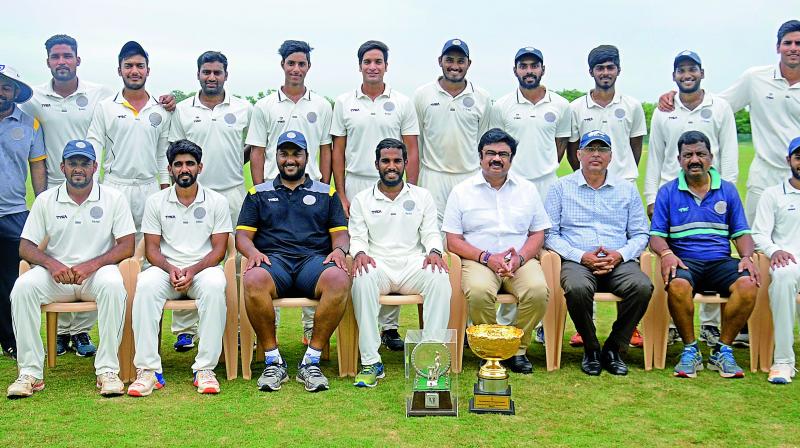 Members of the Hyderabad cricket team pose after winning the all-India Buchi Babu tournament in Chennai on Friday.