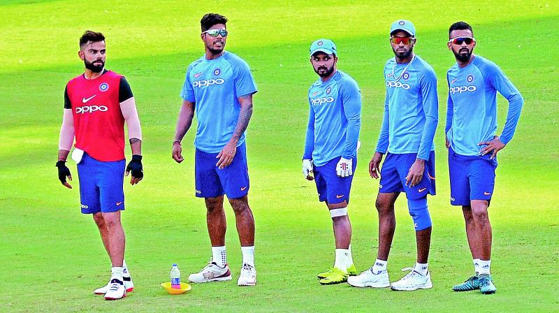 Virat Kohli (from left), Umesh Yadav, Kedar Jadhav, Hardik Pandya and K.L. Rahul during a training session in Chennai on Friday. (Photo: E. K. Sanjay)