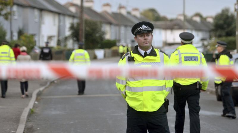 Police officers work near a property in Sunbury-on-Thames, southwest London, as part of the investigation into Fridays Parsons Green bombing. (Photo: AP)