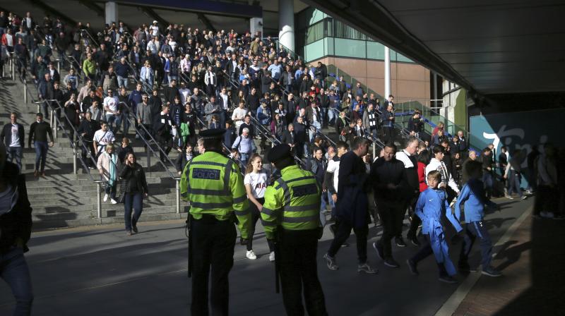 Police observe the crowds outside Wembley Park Station ahead of a soccer match, following a terrorist attack Friday on a train at Parsons Green Station, in London. (Photo: AP)