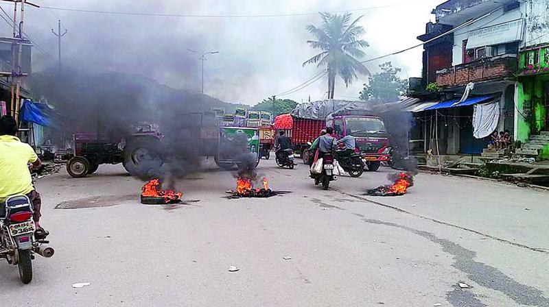Tires and other items being burnt in the middle of the road in Malkangiri. 	(Photo: DC