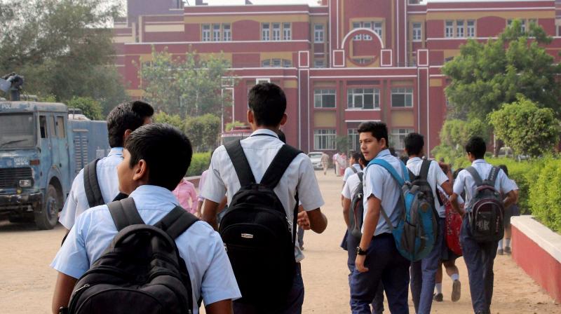 Students arrive at Gurugrams Ryan International School which re-opened on Monday after 10 days closure following the murder of an eight-year-old boy inside a toilet of the school. (Photo: PTI)