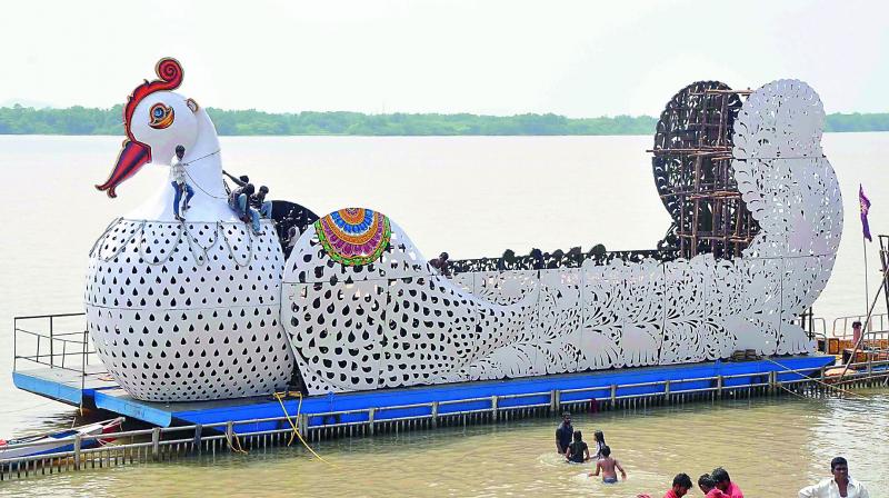 Arrangements of Teppotsavam underway at Durga ghat in Vijayawada on Tuesday. (Photo: DC)