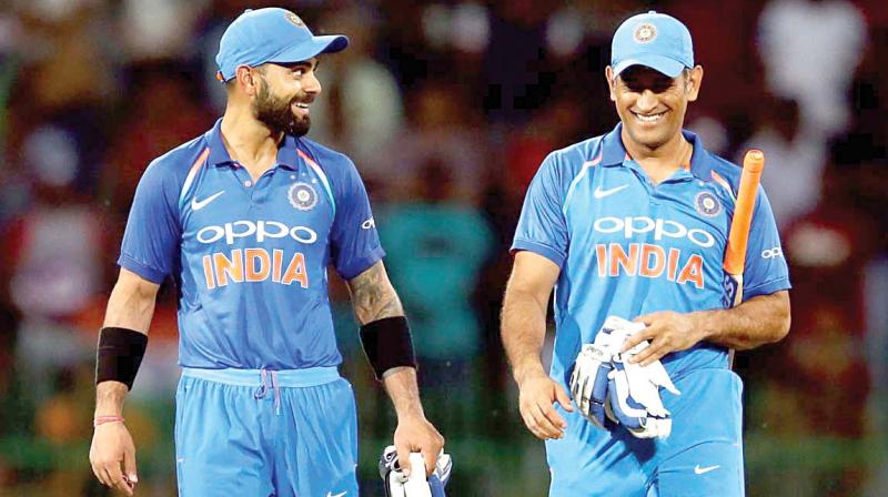 Virat Kohli with MS Dhoni in a file photograph.