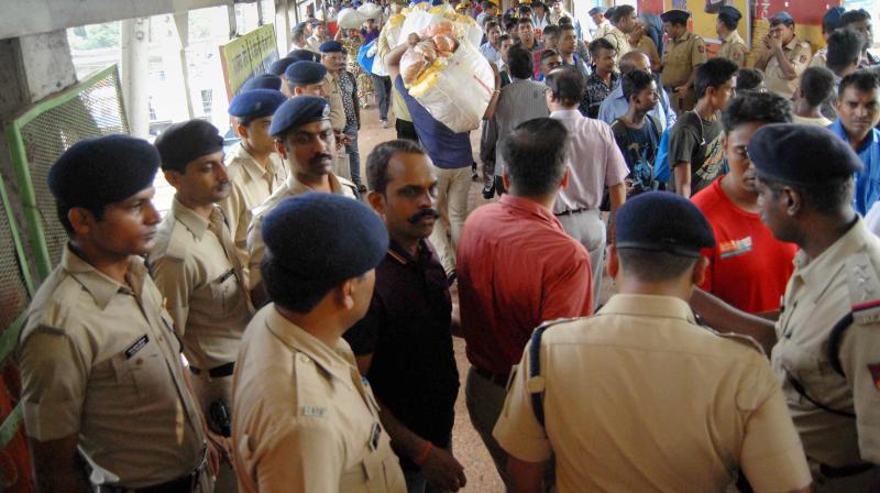 Policemen investigate at the Elphinstone railway station where a stampede took place, in Mumbai on Friday. (Photo: PTI)