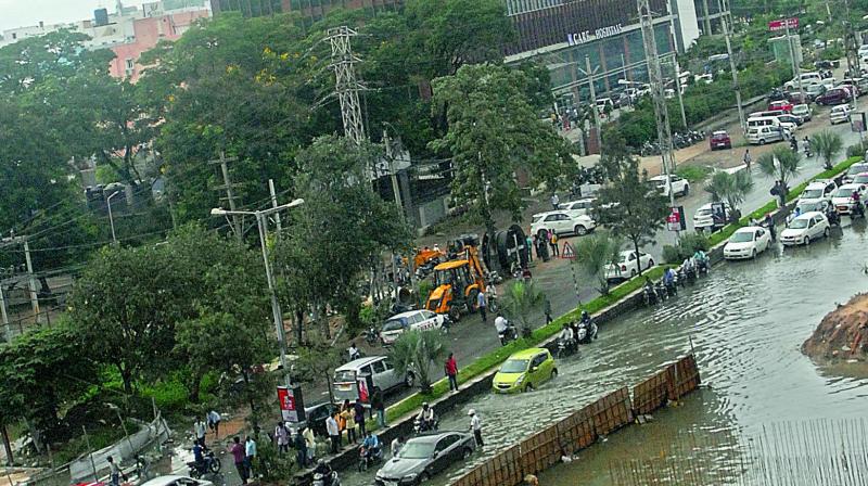 Stagnated water holds up traffic on Gachibowli road.