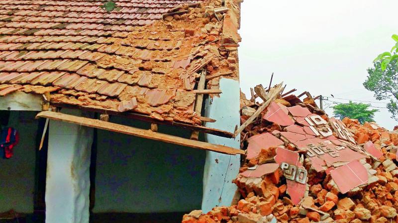 Three decade old house collapsed at Natavaram near Narsipatnam in Visakhapatnam district on Tuesday. (Photo: DC)