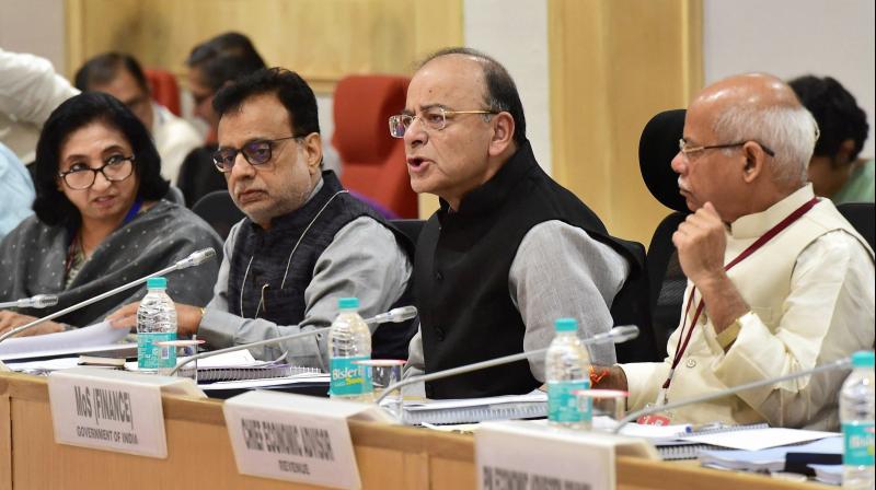 Union Finance Minister Arun Jaitley, MoS for Finance Shiv Pratap Shukla and Revenue Secretary Hasmukh Adhia at the 22nd meeting of the Goods and Services Tax (GST) council, in New Delhi on Friday. (Photo: PTI)