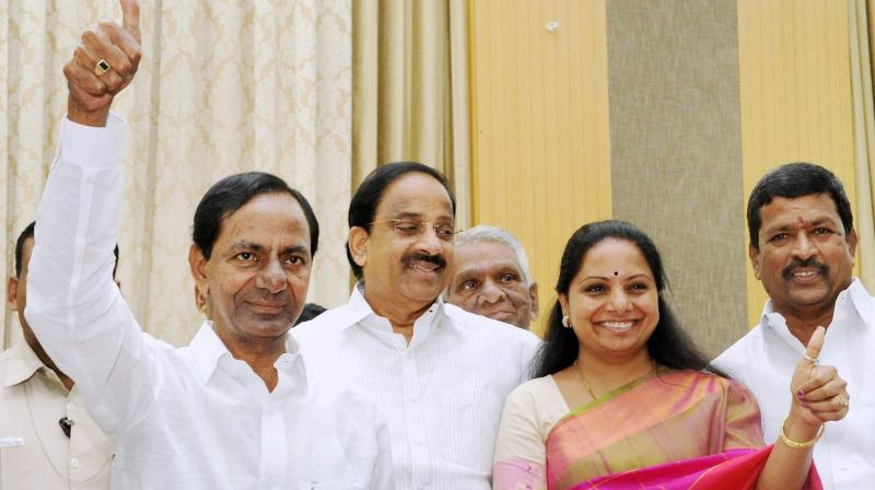 Telangana Chief Minister K Chandra Sekhar Rao and TRS MP K Kavitha showing thumps-up sign as they celebrate the partys victory in Singareni election, in Hyderabad. (Photo: PTI)