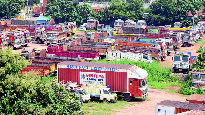 Trucks parked at the Autonagar, Vanasthalipuram in Hyderabad on the first day of the two-days truckers strike. The strike partially affected the supply of vegetables and essential commodities. Except for bookings, deliveries and operating services, the Telangana Lorry Owners Association allowed other services including pre-loaded trucks to function normally. Nearly 80 per cent trucks kept off the roads. In lieu of the strike, the marketing department of the state made alternative arrangements for the smooth supply of vegetables and essential commodities. (Photo: DC)