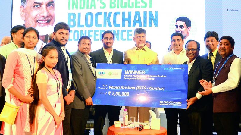 Chief Minister N. Chandrababu Naidu presents the winners award of Fintech Valley Towers Summer Product Entrepreneurship Workshop to the students of KITS, Guntur, Vamsi Krishna and his team at the inaugural session of Blockchain Business Conference organised by Fintech Valley at Novotel Hotel in Visakhapatnam on Monday. (Photo: DC)