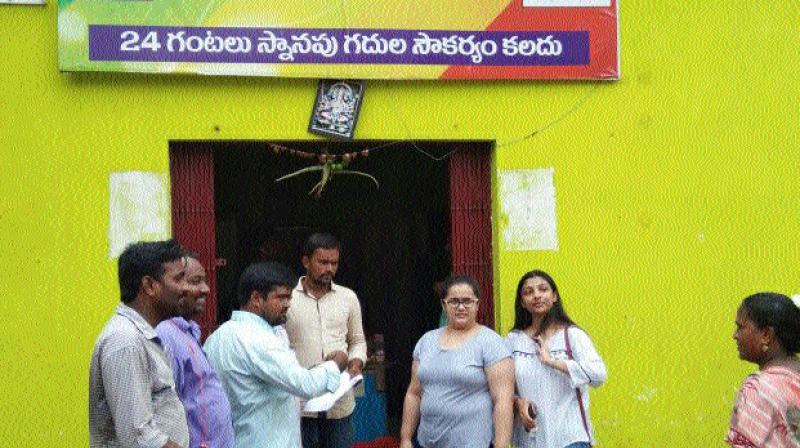 Officials of Quality Council of India (QCI), Nikitha Gupta and Gauri Preeth Kaur, at the toilets in Guntur city on Tuesday. (Photo: DC)