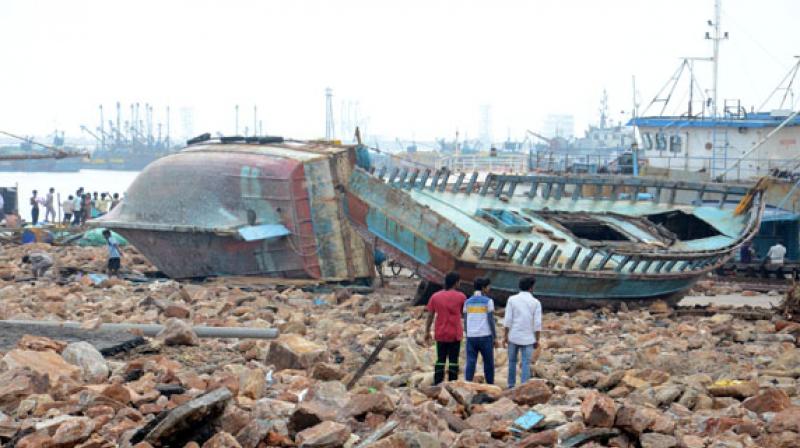 Boats and shipping vessels washed ashore at the outer harbour in Visakhapatnam due to Cyclone Hudhud (Photo: File/Murali Krishna)