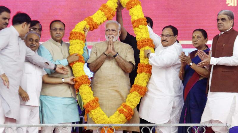 Prime Minister Narendra Modi being felicitated at a public meeting in his hometown Vadnagar. (Photo: PTI)