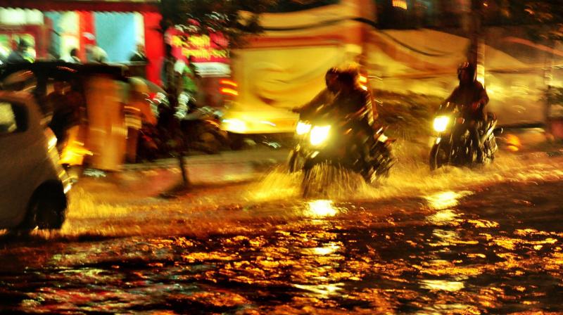 Vehicles wade through flooded streets at Jubilee Hills in Hyderabad. (Photo: PTI)