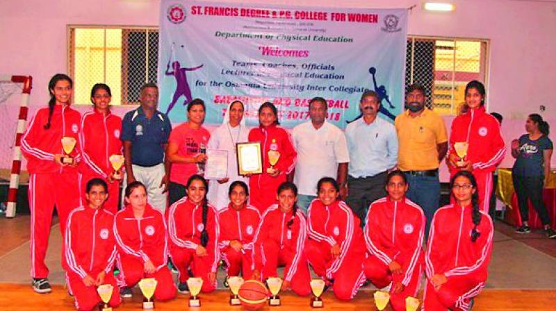 St Francis College womens basketball team pose with the trophies after beating St Anns College in the final to emerge champions in the Osmania University Inter-Collegiate Basketball tournament.