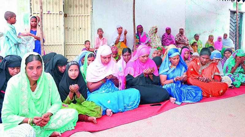 The residents of Borabanda, who were woken by the tremors in the early hours of Saturday, offer special prayers at Bharathnagar on Sunday. (Photo: DC)